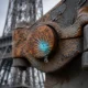 electrically charged raindrops corroding Teflon coated metal