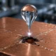 electrically charged raindrops corroding Teflon coated copper